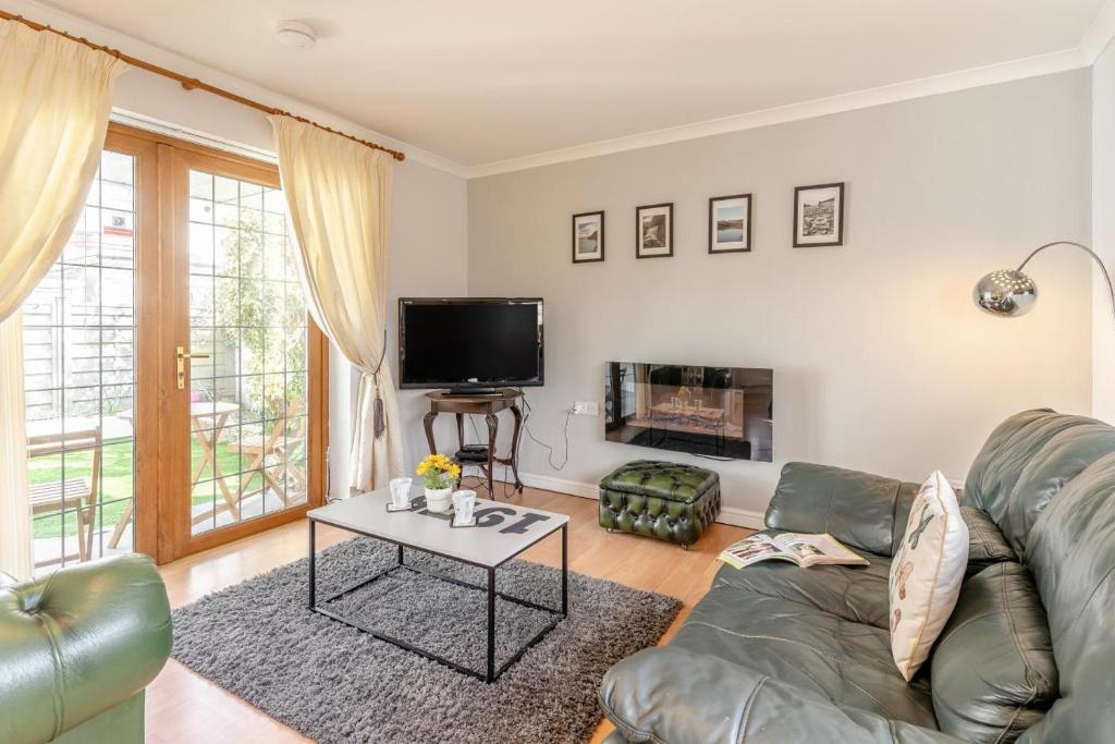 a living room with a couch and a table at 1 Bed in Bishopston oc-hh654 in Bishopston