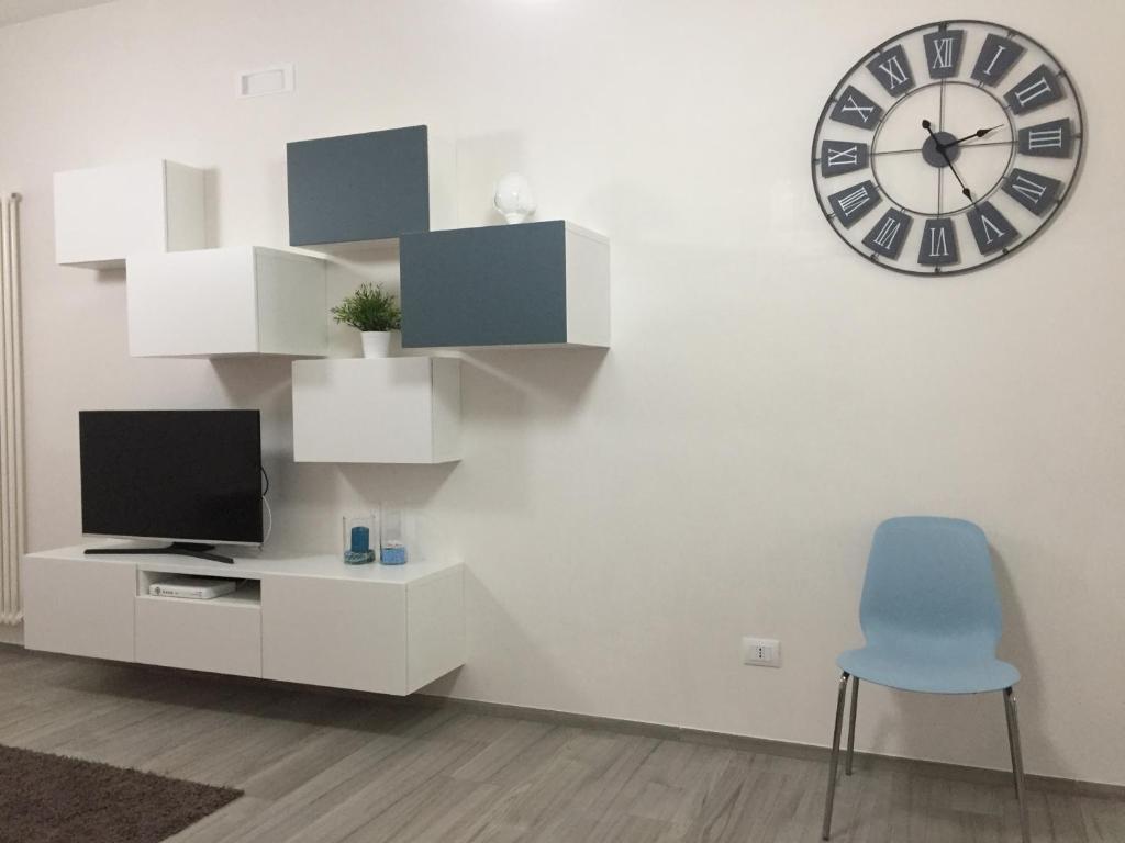 A television and/or entertainment centre at Profumo d'aMARE