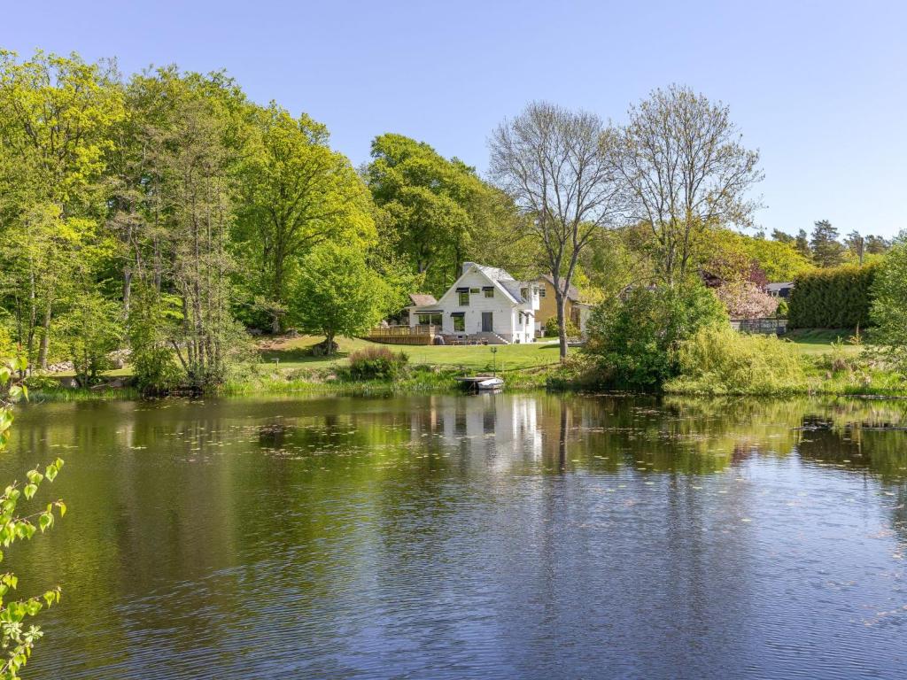 a house sitting on the shore of a lake at Villa Villa Anja by Interhome in Asarum