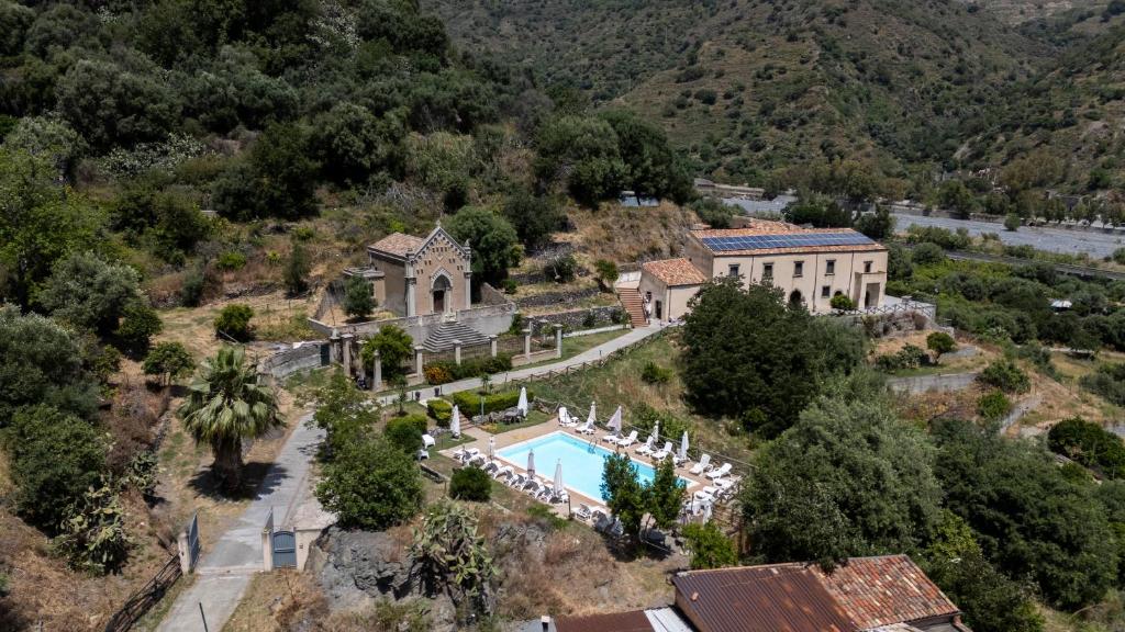 an aerial view of a house with a swimming pool at La Locanda degli Amici in Santa Teresa di Riva