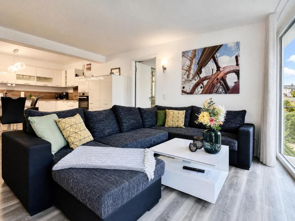 a living room with a couch and a table at Ferienwohnung Meeresblick Haus Granitz in Prora in Binz