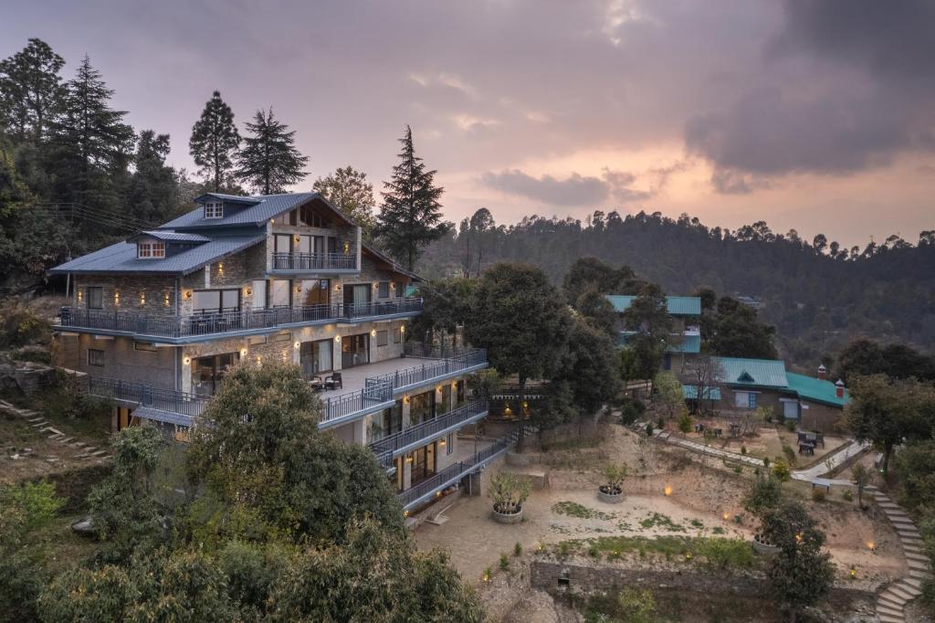 an aerial view of a house in the mountains at Dharohar Retreat, Mukteshwar in Mukteshwar