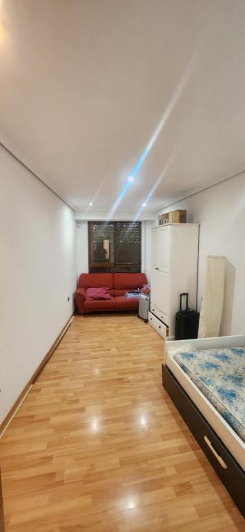 a room with a couch and a bed in it at Torrent in Torrent