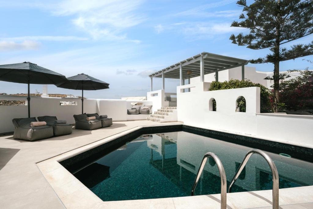 a pool in the backyard of a villa at Sunrise Paros by Mr and Mrs White in Naousa