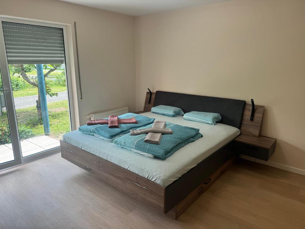 a bedroom with a bed with towels on it at Stay Zentral Dresden in Dresden