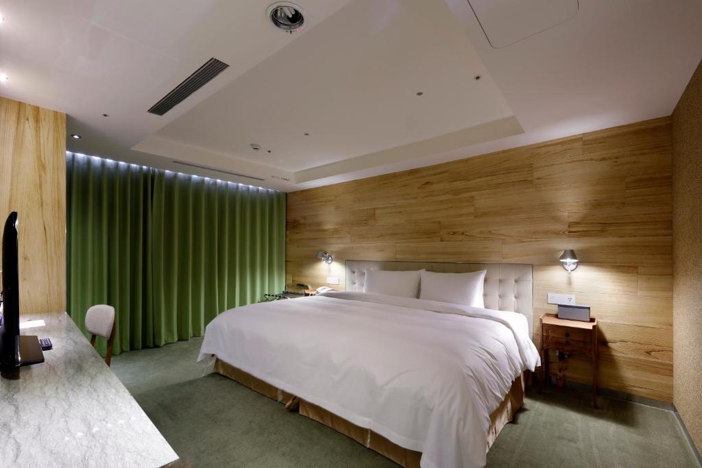 Postel nebo postele na pokoji v ubytování Inhouse Hotel Taichung
