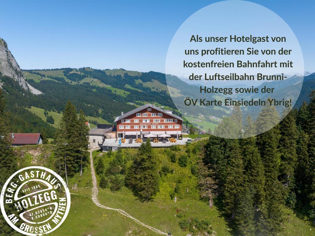 a picture of a building in the mountains at Berggasthaus Holzegg - Accessible Only by Cable Car in Alpthal