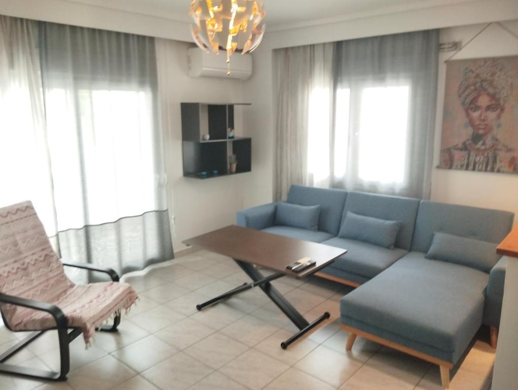a living room with a couch and a table at 2ndHome in Perea