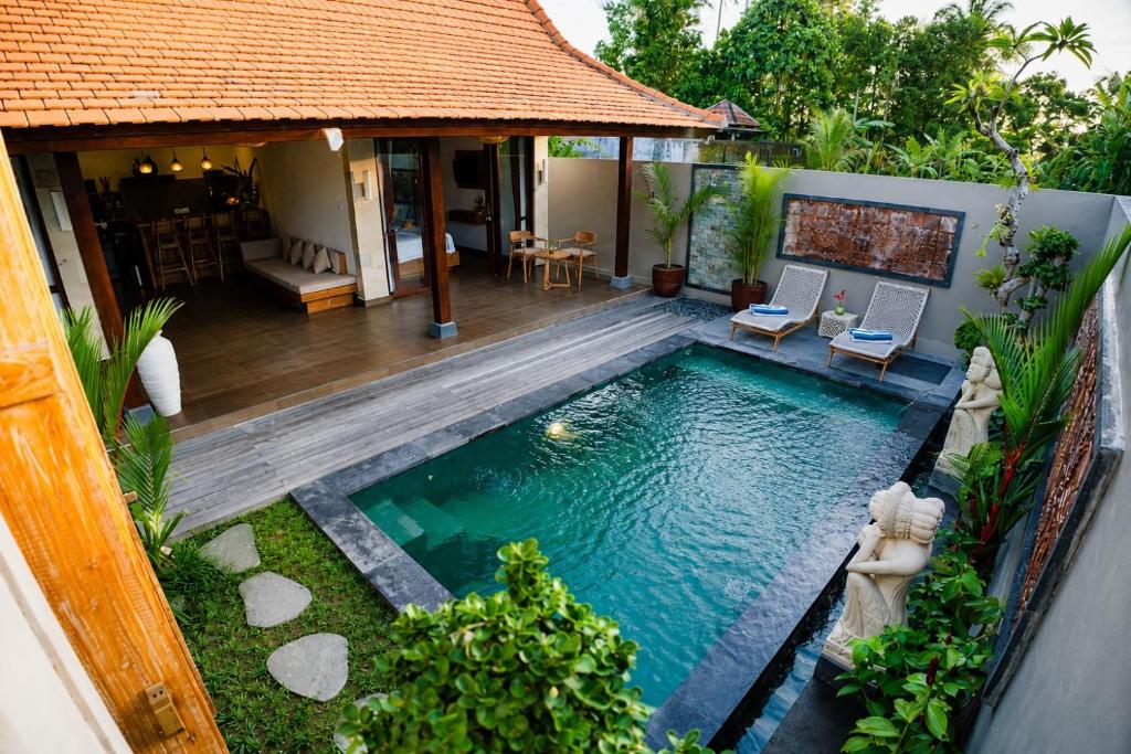 an aerial view of a swimming pool in a house at Ardinia Villa Ubud Private Pool in Ubud