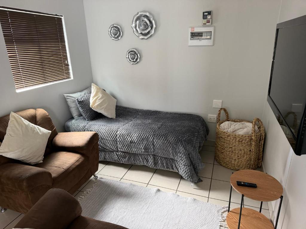 a living room with a couch and a chair at The Gather Inn Bethlehem in Bethlehem