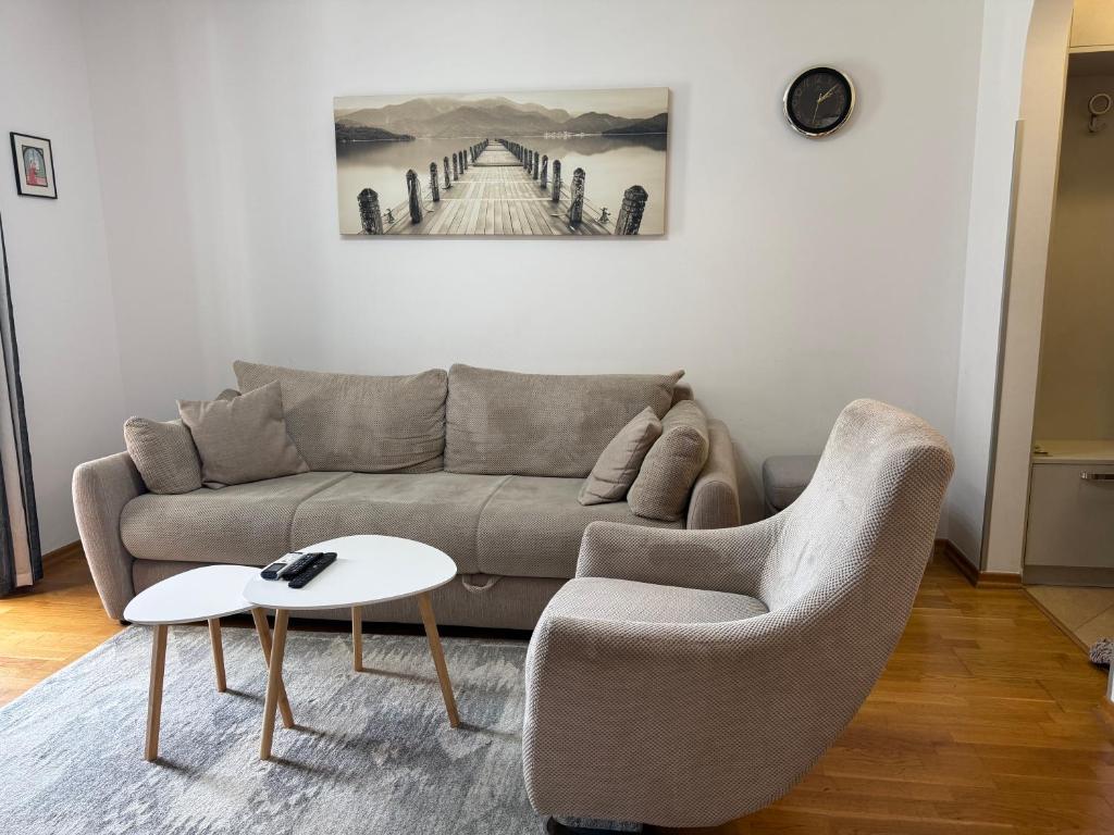 a living room with a couch and a table at Promenade,5 min Old Town in Kotor
