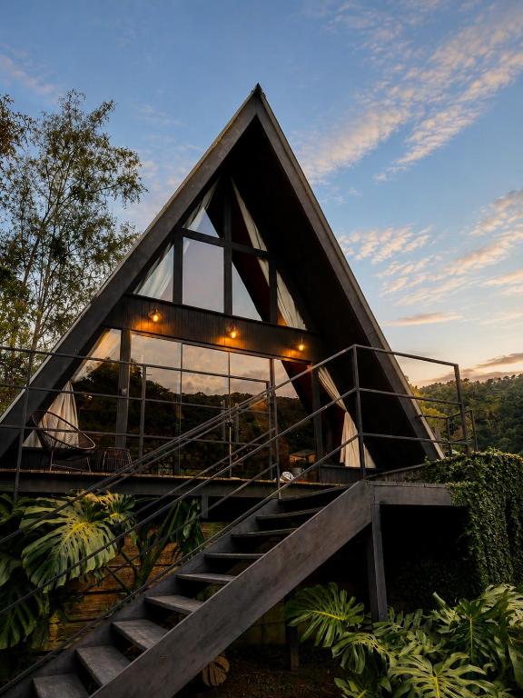 a house with a staircase with lights on it at Cabana da Mata - Teresópolis in Teresópolis