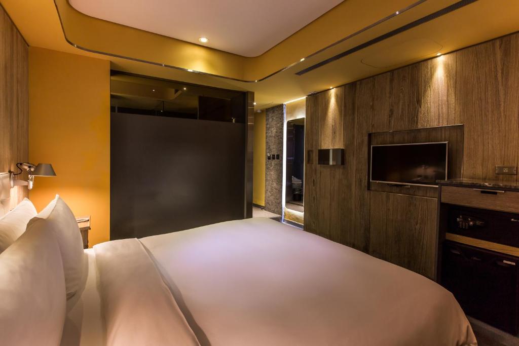 Postel nebo postele na pokoji v ubytování inhouse Hotel
