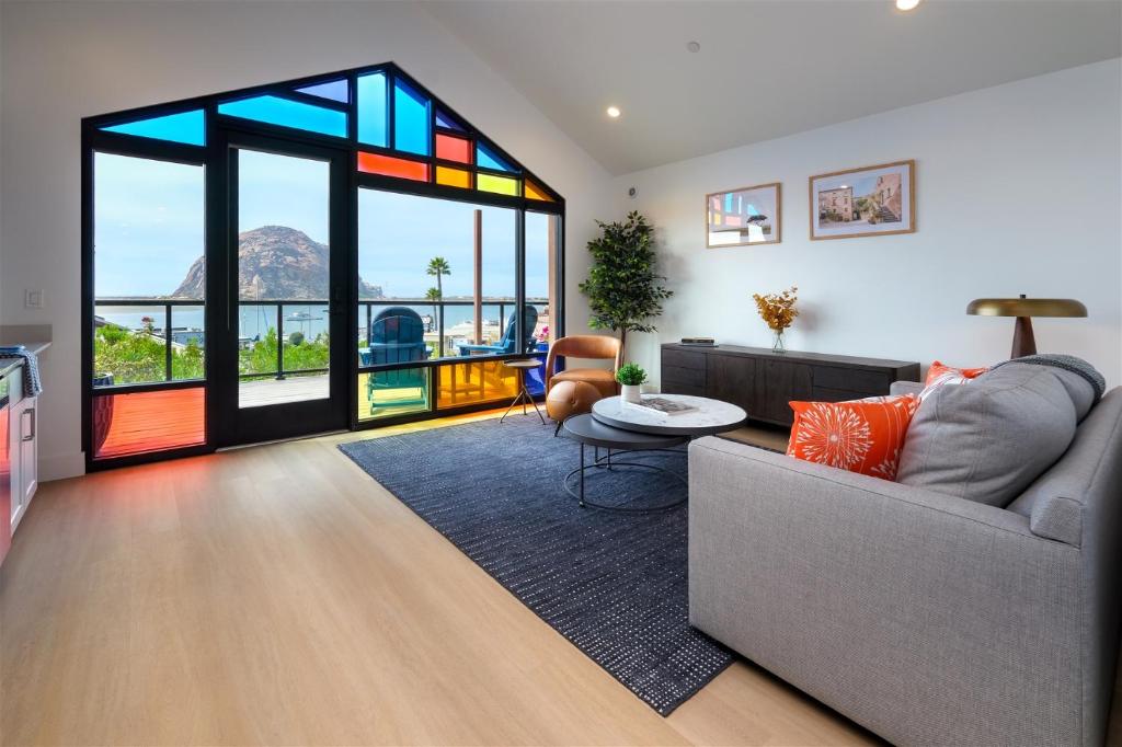 a living room with a couch and a large window at Harbor View 101 in Morro Bay