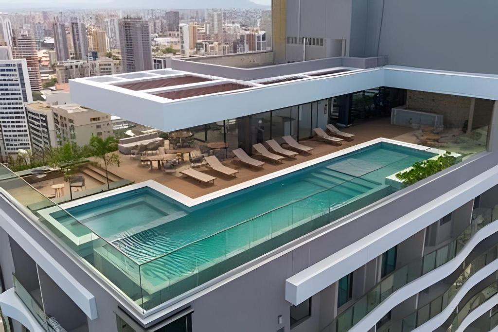 an overhead view of a building with a swimming pool at Beach Class Meireles by HostFacil in Fortaleza