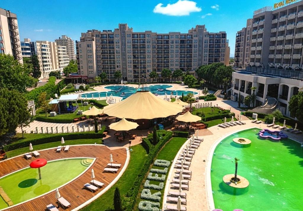 an aerial view of a park with chairs and umbrellas at Arendo Sun - studio in Barceló Hotel in Sunny Beach