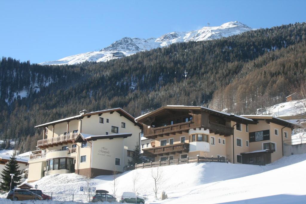 a large building on top of a snow covered mountain at A Casa Juwel Apartment in Sölden