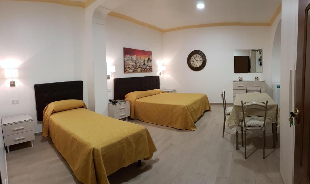 Postel nebo postele na pokoji v ubytování Hotel Artorius