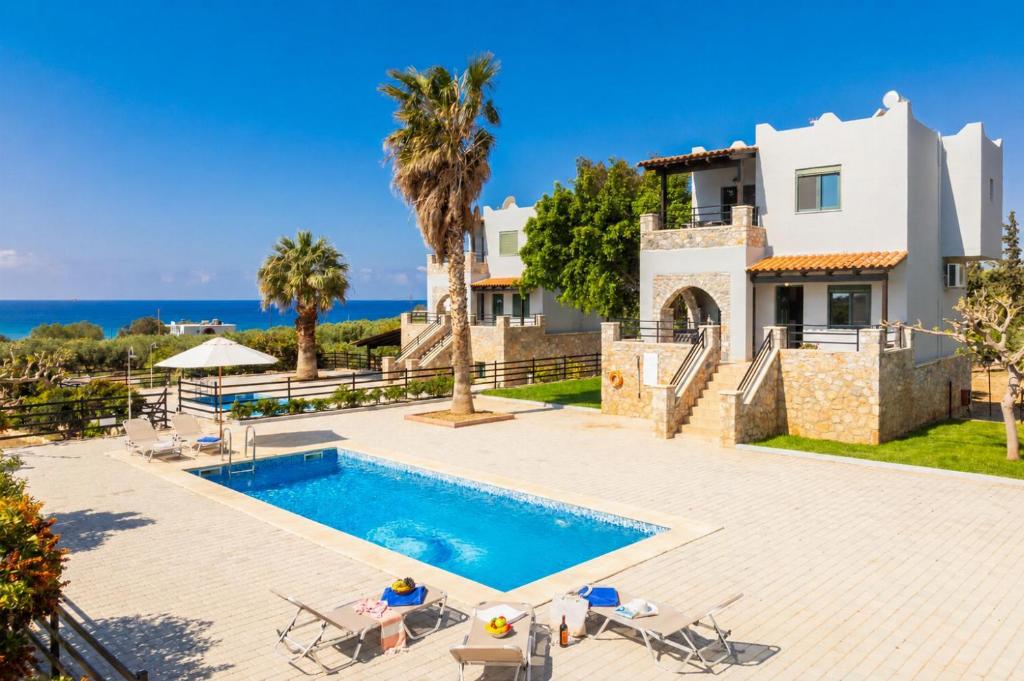 an image of a villa with a swimming pool at Andreas Beach Villa in Sfakia