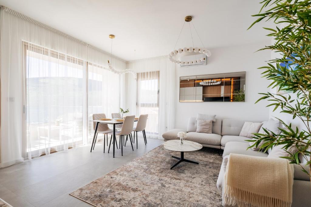 a living room with a couch and a table at Maria Premium BELLA VISTA in Baošići
