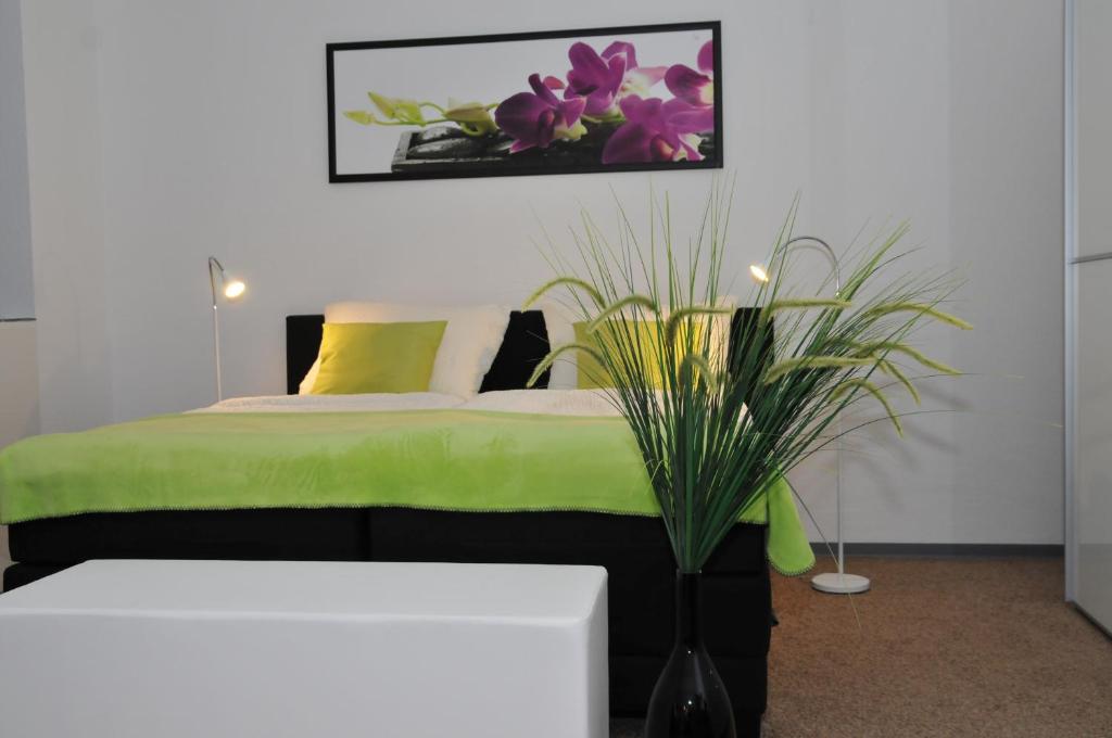 En eller flere senge i et værelse på Gästehaus beim Prinz