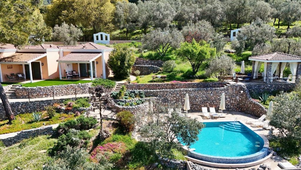 an aerial view of a house with a swimming pool at D&C Göcek Hotel in Göcek
