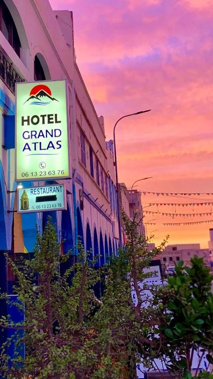a hotel channel atlas sign on the side of a building at Hôtel grand Atlas in Mirleft