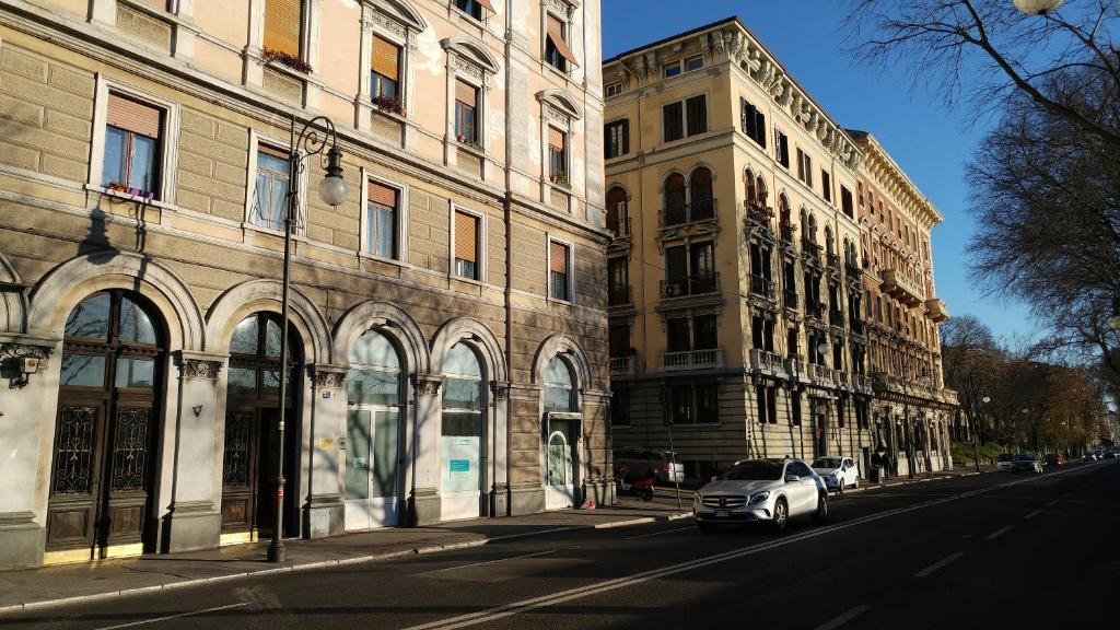 a car parked on a street next to buildings at 0.3 Stanze in Trieste