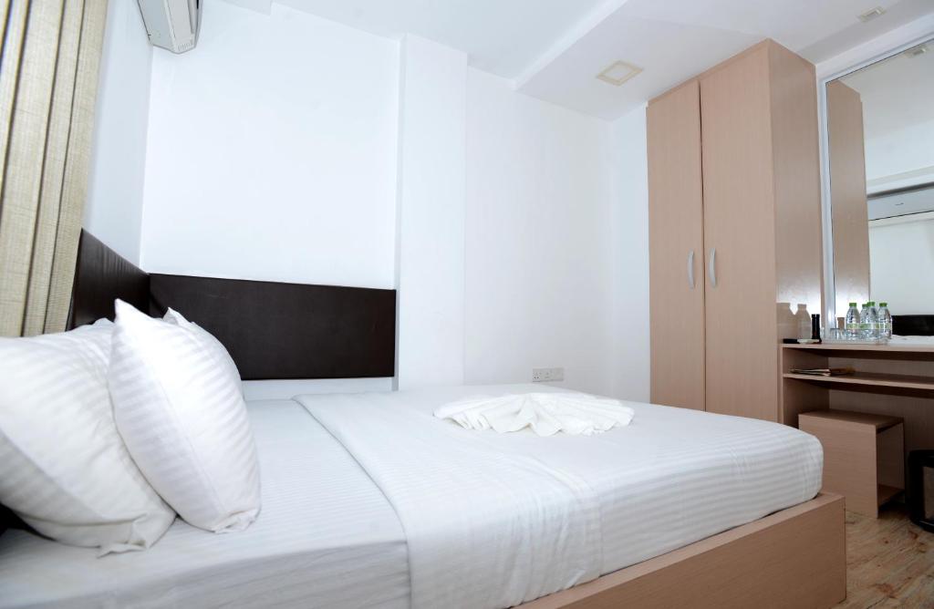 Postel nebo postele na pokoji v ubytování Express Inn at Hulhumale