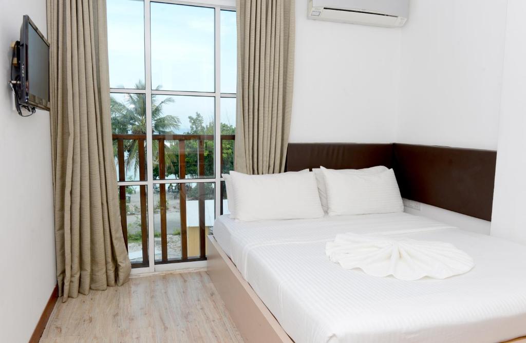 Postel nebo postele na pokoji v ubytování Express Inn at Hulhumale