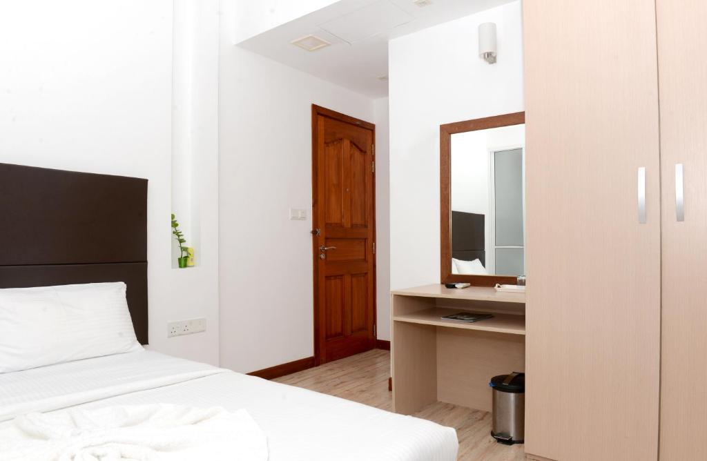 Postel nebo postele na pokoji v ubytování Express Inn at Hulhumale