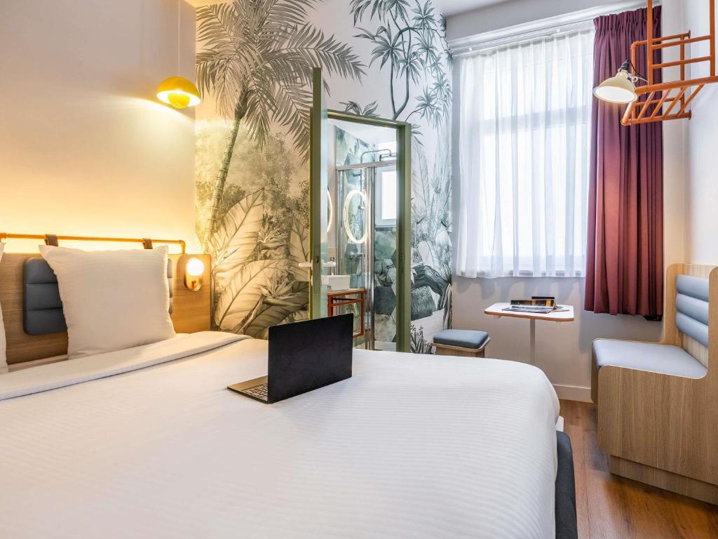 Postel nebo postele na pokoji v ubytování Ibis Styles Brussels Centre Rogier