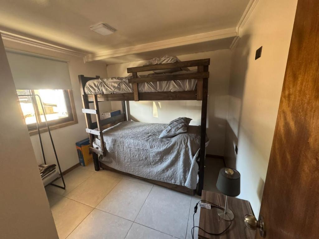 a bedroom with two bunk beds in a room at ALMAR House in Guaquen
