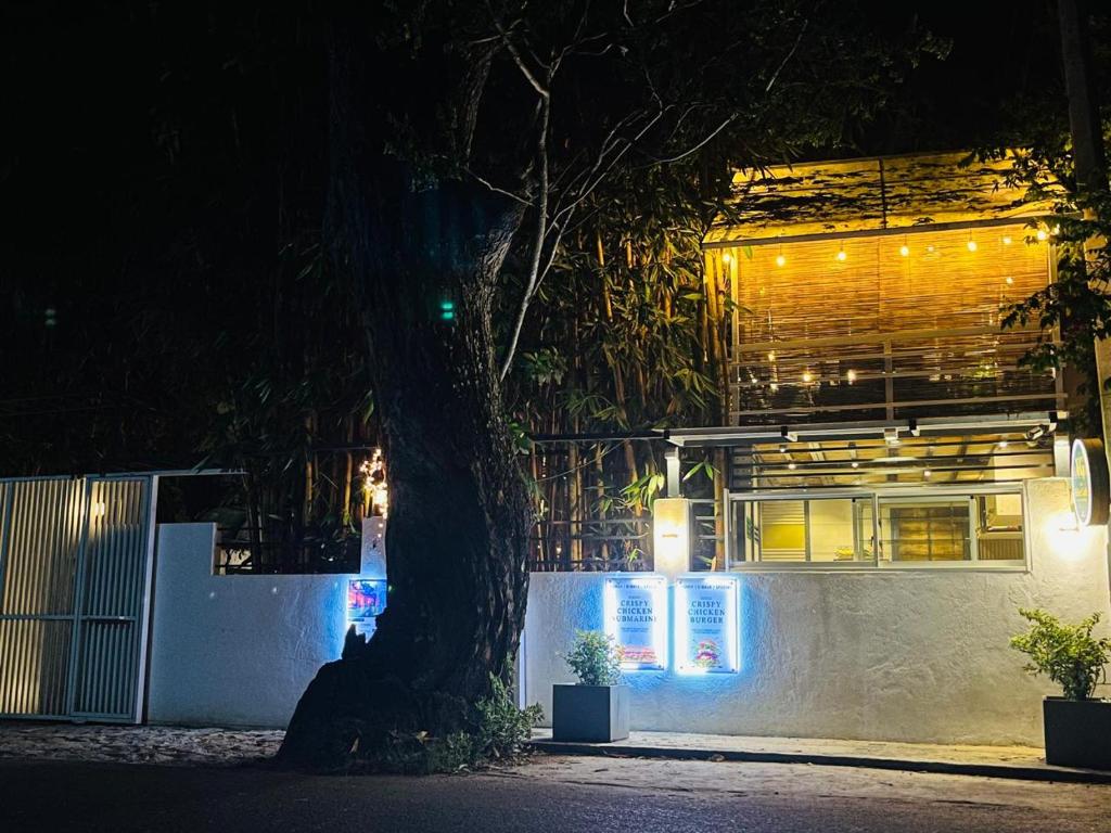 a building with lights in front of it at night at Eighty seven guest and restaurant in Badulla