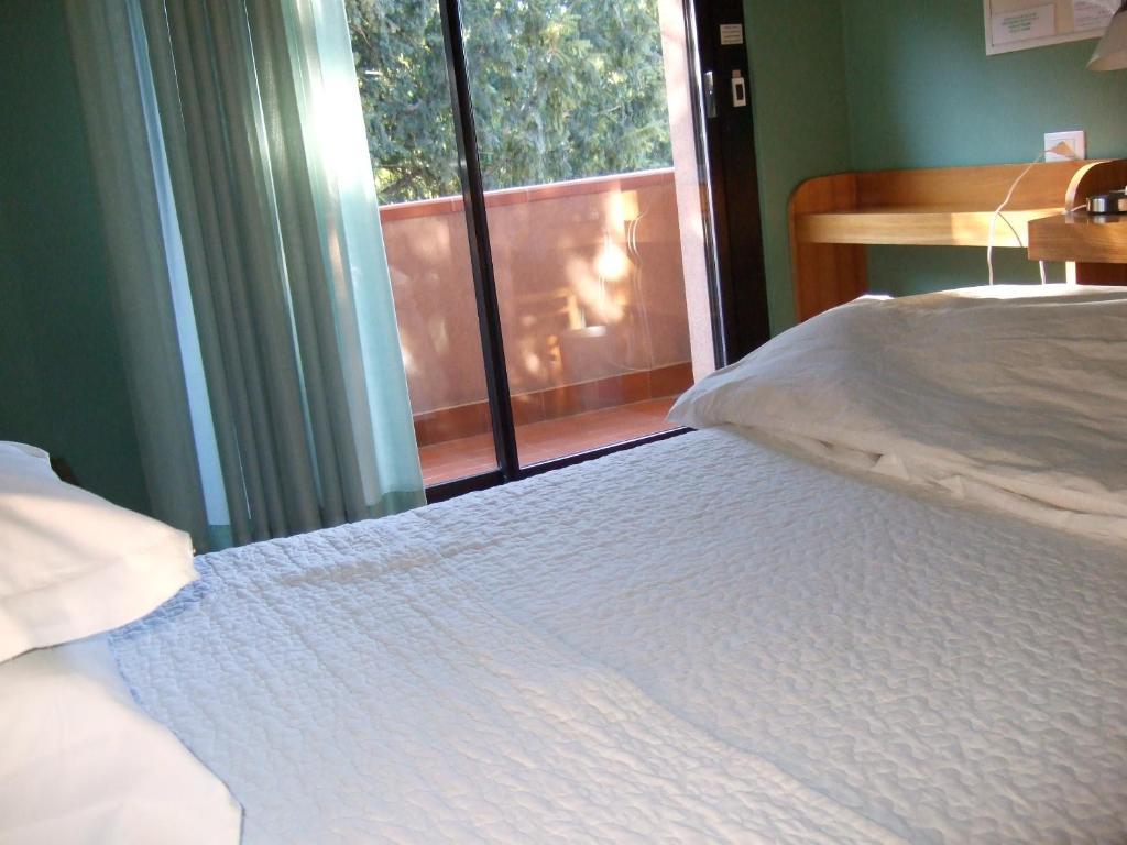 Postel nebo postele na pokoji v ubytování Hotel Canturio