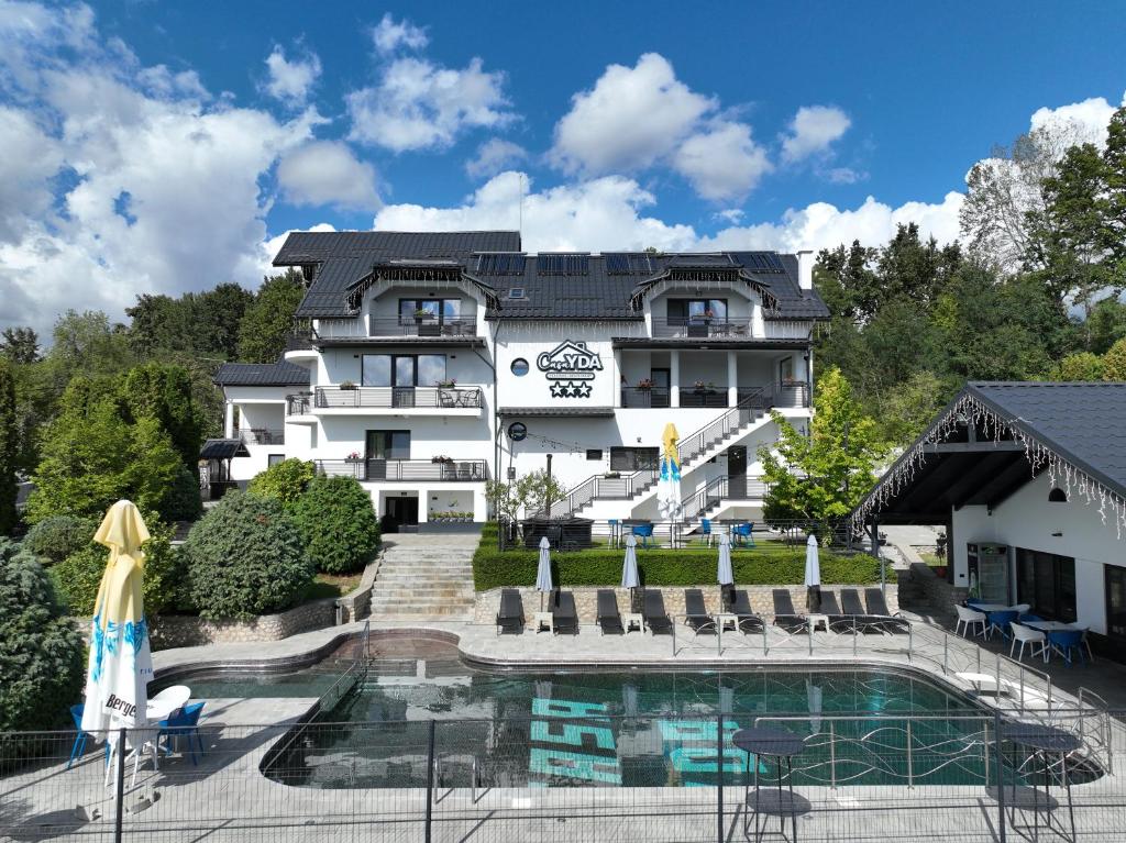 a view of a hotel with a pool at Casa YDA in Horezu