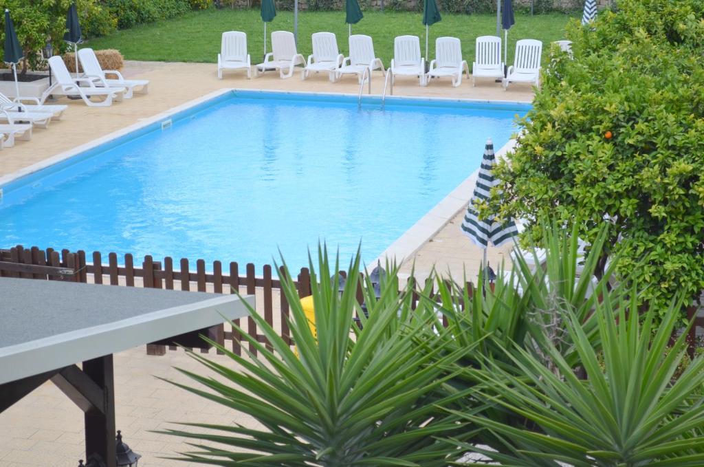The swimming pool at or close to Il Giardino Del Sole