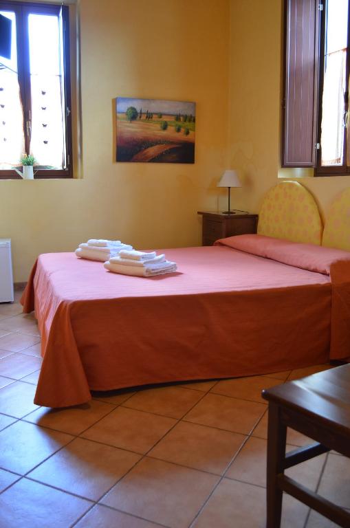 A bed or beds in a room at Il Giardino Del Sole