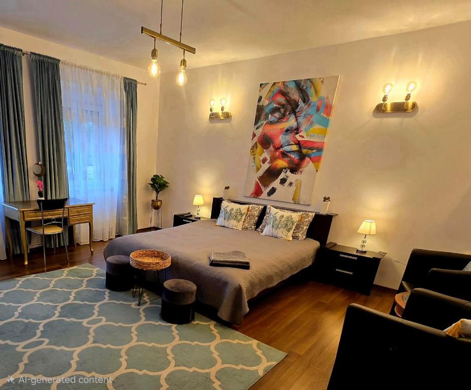 a bedroom with a bed and a painting on the wall at Atia Residence in Sibiu