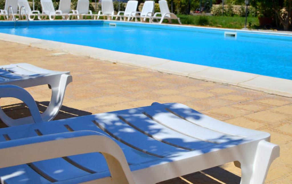 The swimming pool at or close to Il Giardino Del Sole