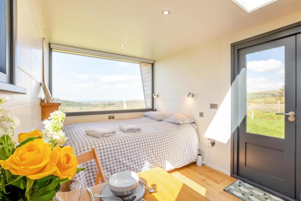 a small bedroom with a bed and a window at 1 Bed in Ponsonby oc-l37879 in Gosforth