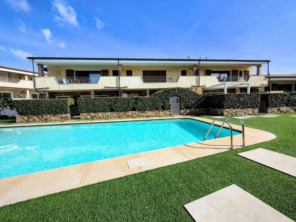a swimming pool in front of a house at Seaside Home - Palau in Palau