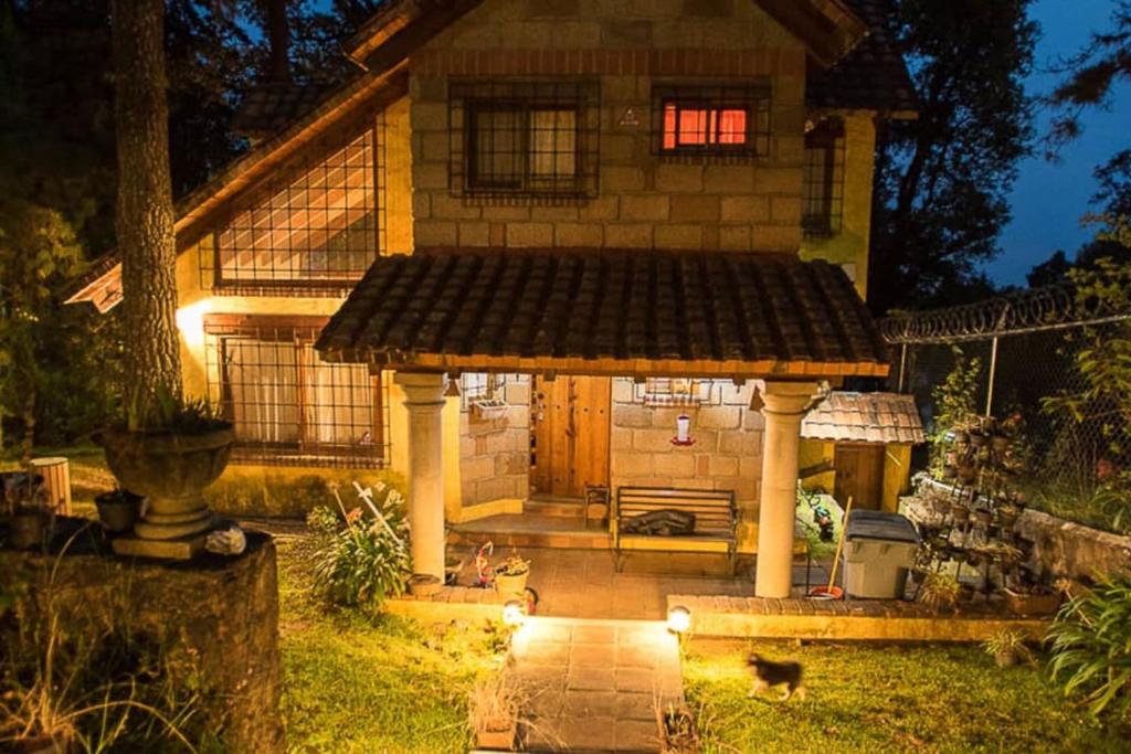 a house with a gazebo in the yard at Private Stunning Cottage In Forest Cuernavaca CDMX in Huertas de San Pedro