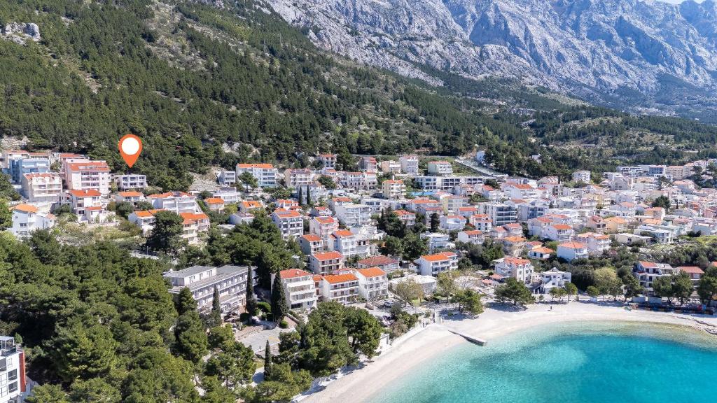 an aerial view of a town with a beach and mountains at Apartments Vedra in Baška Voda