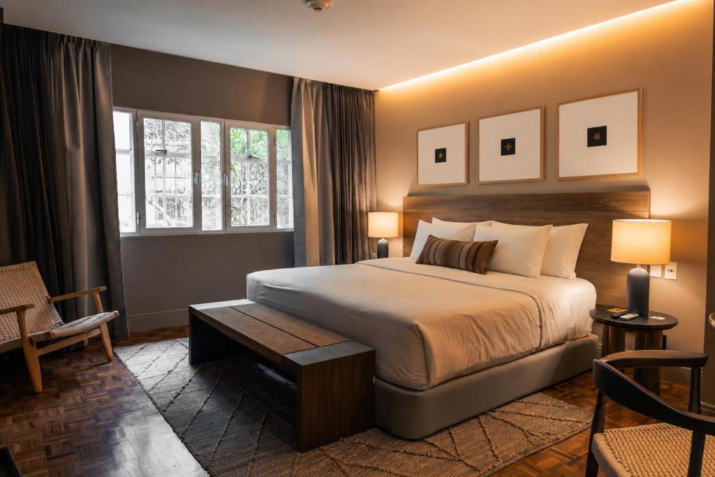 a hotel room with a bed and a window at Maria Condesa Boutique in Mexico City