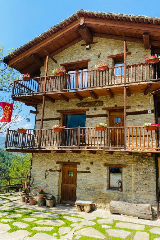 a building with balconies on the side of it at Baita Mot in Marmora