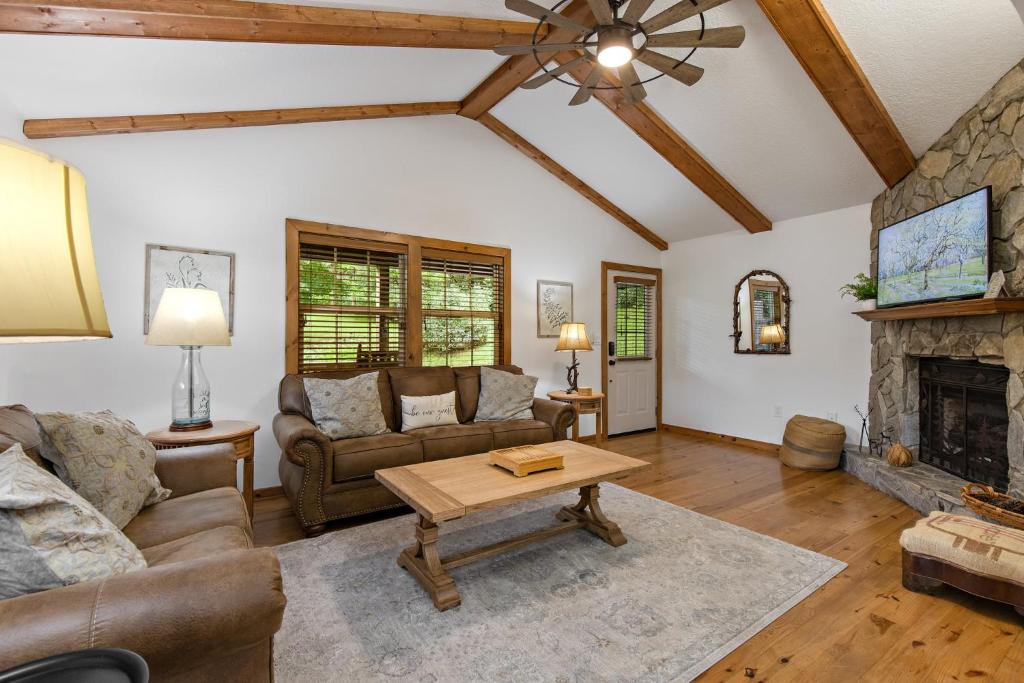 a living room with a couch and a fireplace at Fehrway to Heaven in Blowing Rock