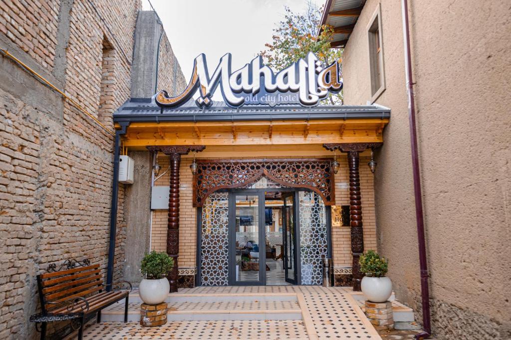 a entrance to a store with a sign that reads miracles at Mahalla Old City Samarkand in Samarkand