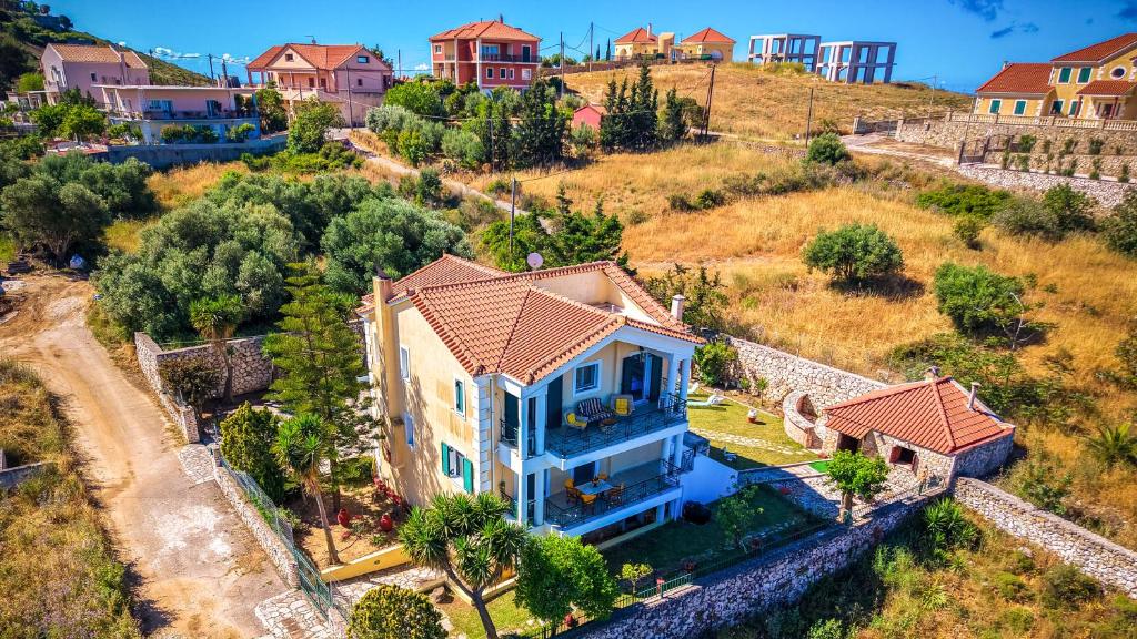 an aerial view of a house with blue at Villa Rodothea in Khelmáta