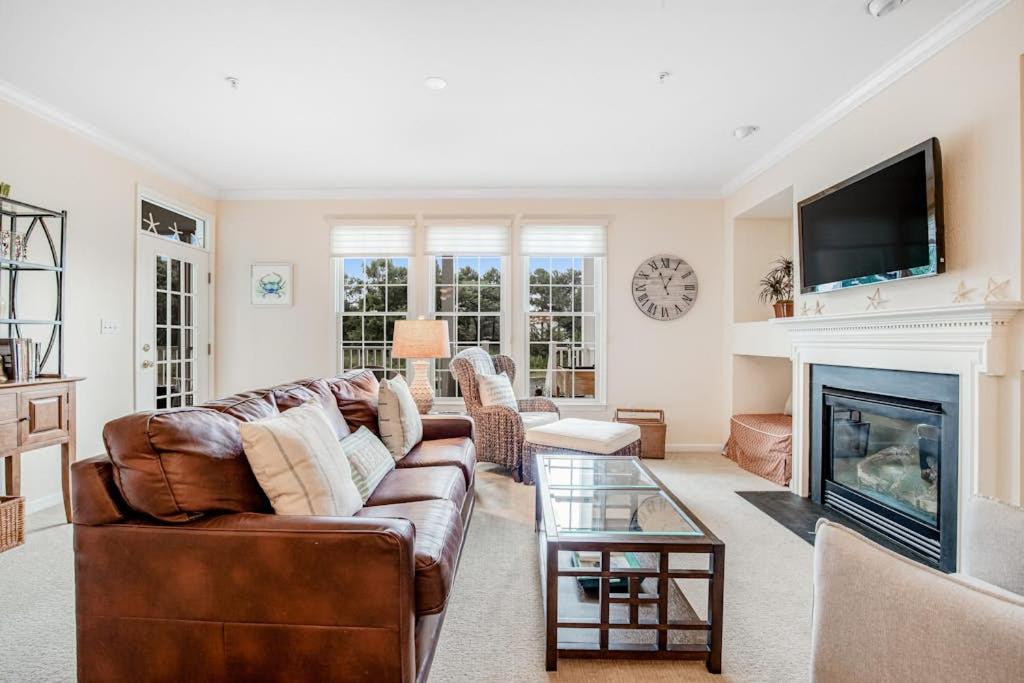 a living room with a couch and a fireplace at Bear Trap Dunes - 56E October Glory in Ocean View